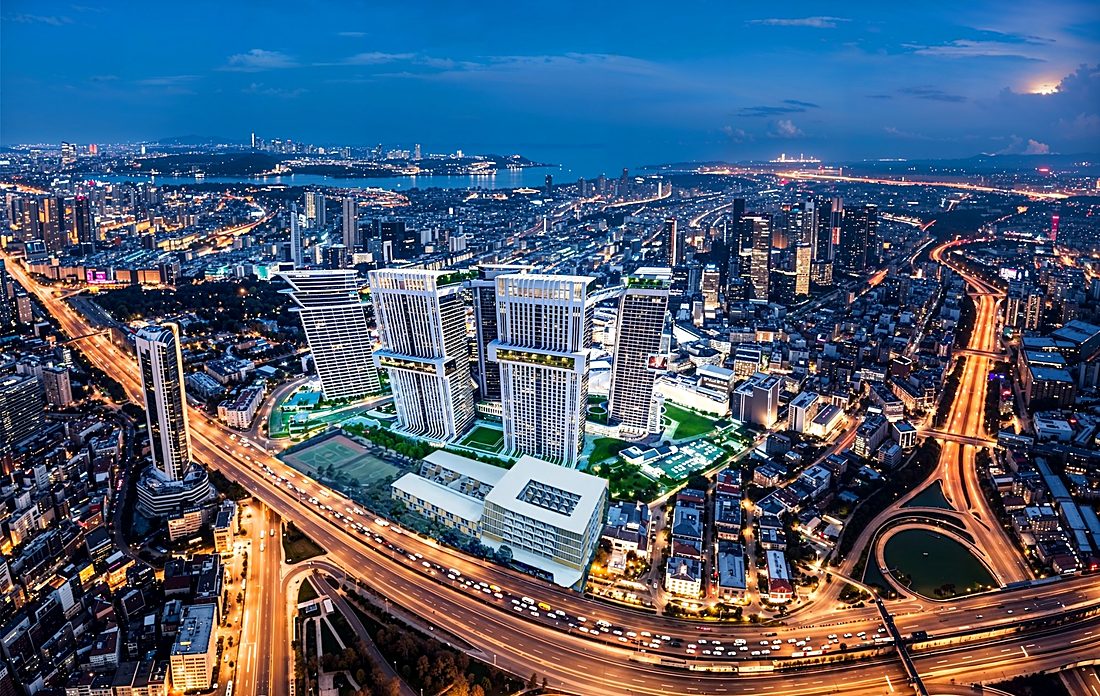 The site from above, the highway running past it into the city
