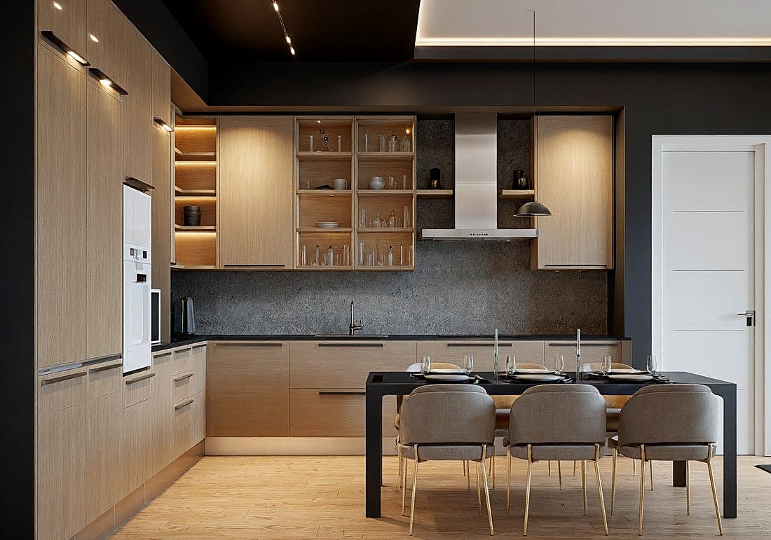 A kitchen with an island, dark stone splashback and pale cabinetry