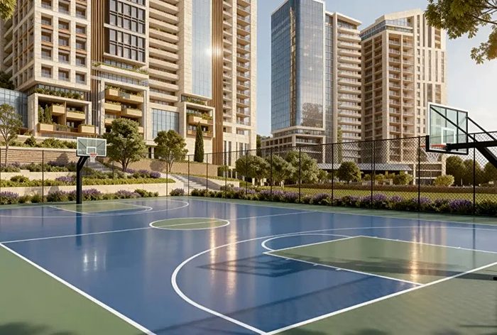 A blue basketball court on the podium, the blocks rising behind it