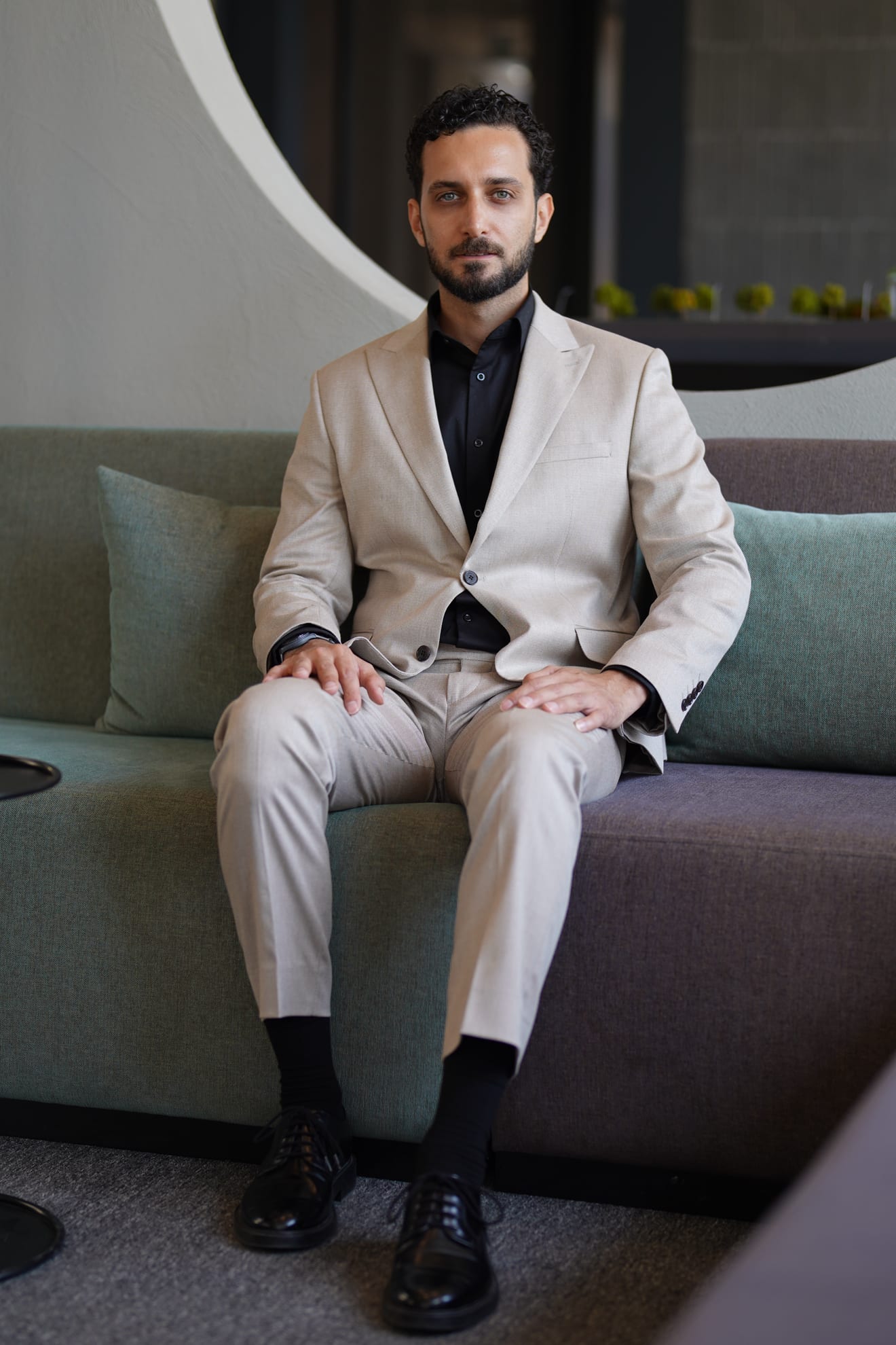 Erfan Naji seated, looking to camera